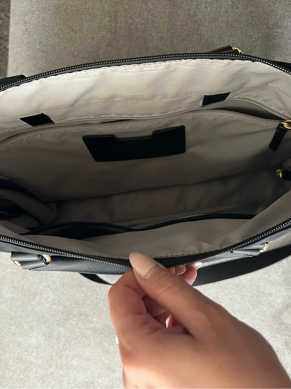 Tumi Black Bag Interior with Gold Logo Detail
